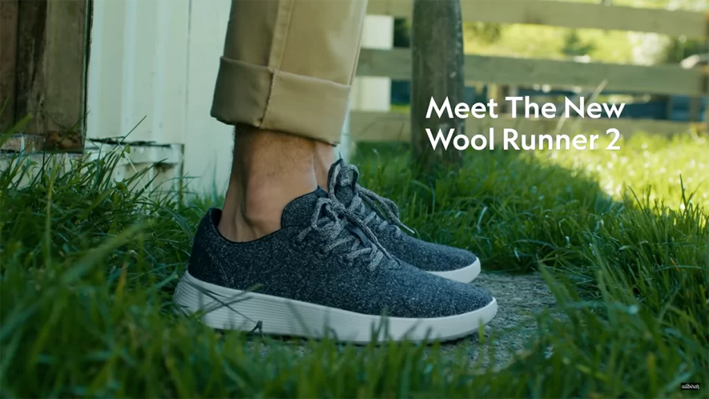 A pair of runners called the 'Wool Runner Two', with a text overlay "Meet The New Wool Runner 2".