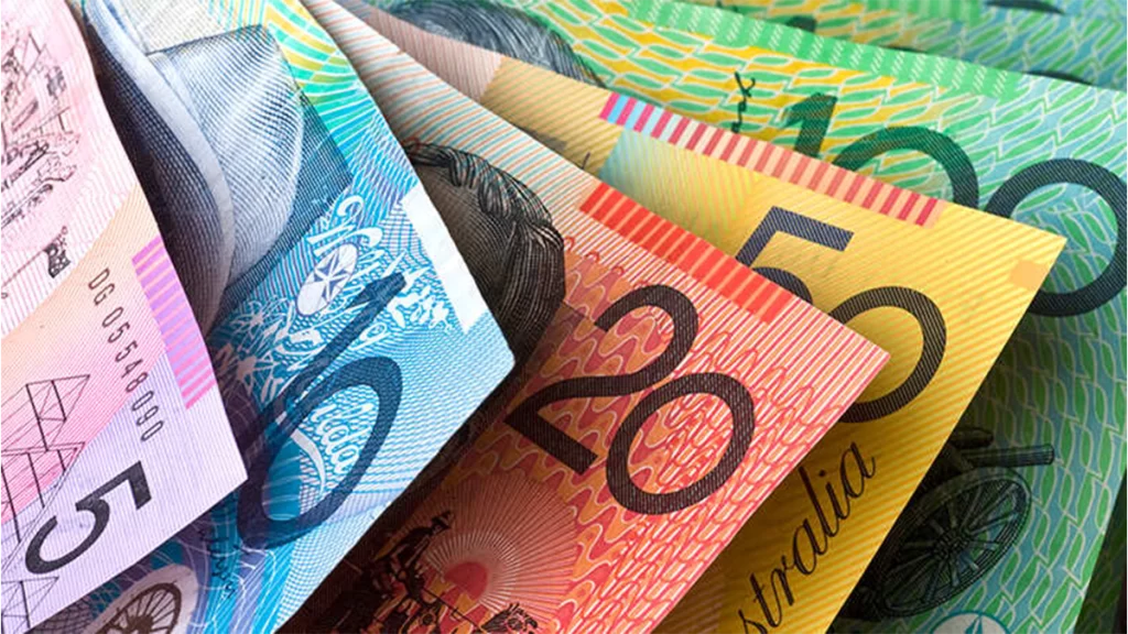 The Australian notes. A pink 5 dollar note, blue 10 dollar note, red 20 dollar note, yellow 50 dollar note and green 100 dollar note.