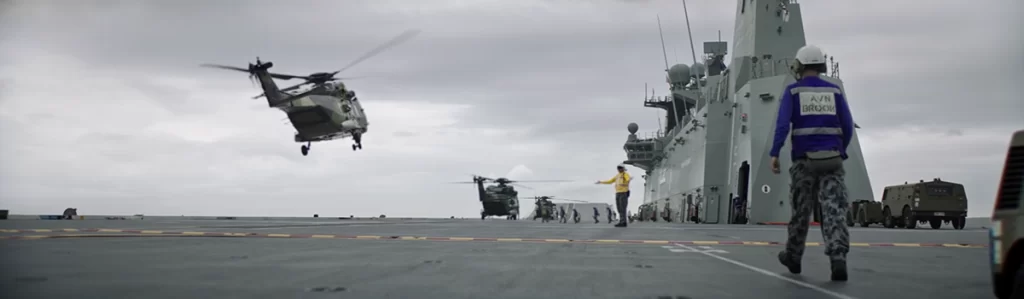 A helicopter landing on an Australian Defence Force Aircraft Carrier.