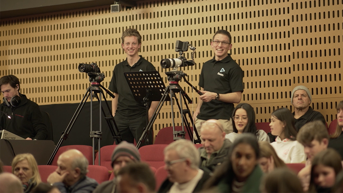 Two Fixon Media Group staff members filming a school production in Melbourne, Australia.