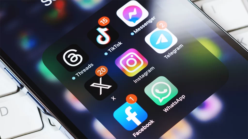 A phone screen displaying 8 popular social media applications with notifications, including Instagram, Facebook, TikTok and more.