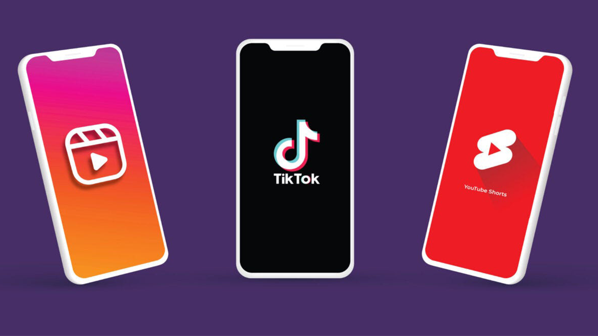 3 Phones each displaying a site of a social media platform. From left to right, 'Instagram Reels', 'TikTok', 'YouTube Shorts'.