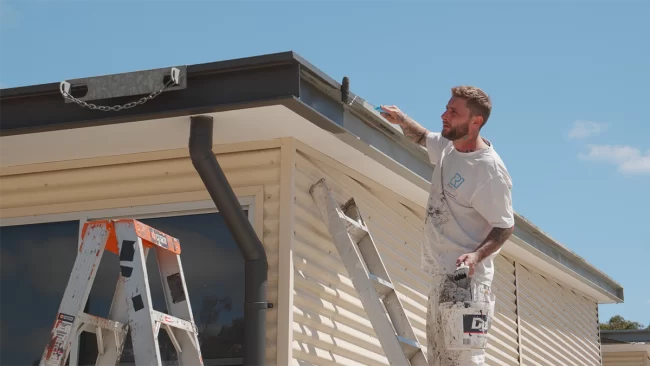 A painter from Resolute Painting working onsite on a building at Cranbourne Primary School.