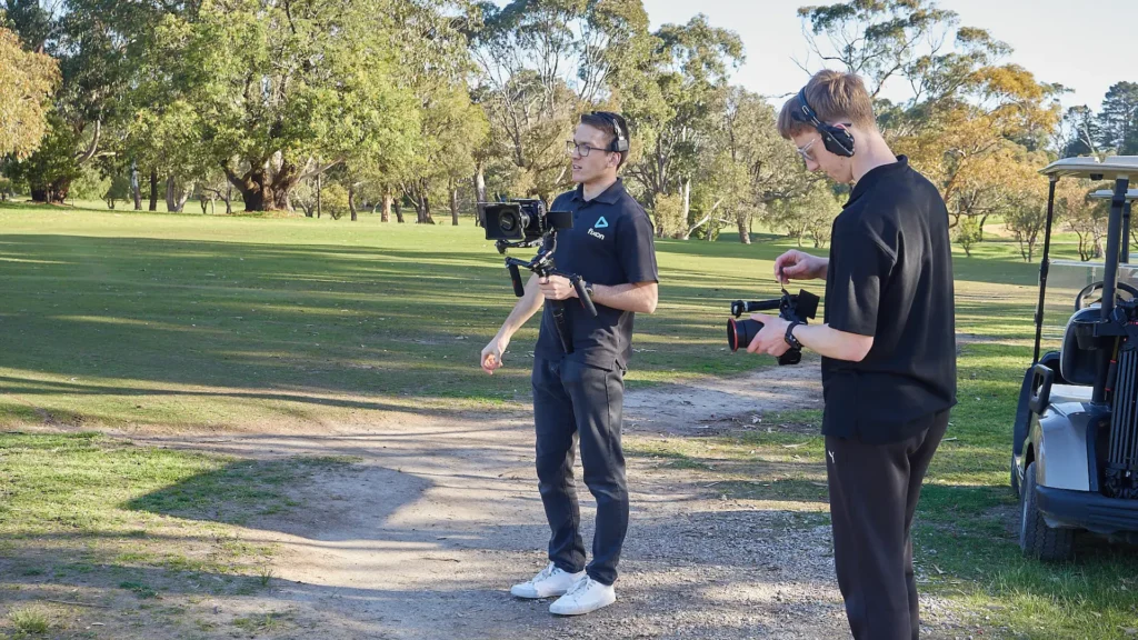 Behind the scenes video production filming at a golf course - Fixon Media Group.